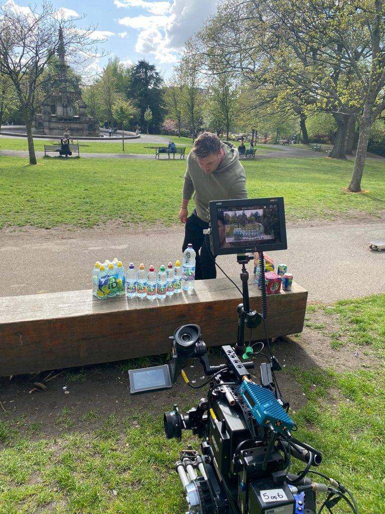 Man organising bottles behind the scenes